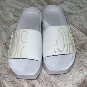 All white Jordan slides